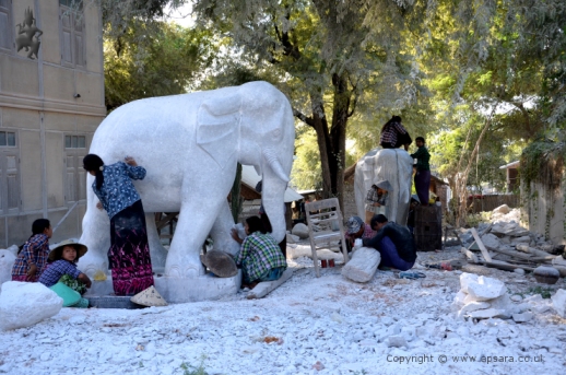 Carving elephants from white marble at Sagyin ...