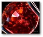 Be-treated orange/red sapphire from Songea.