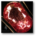 Zircon particle inclusions commonly seen in Madagascan pink sapphires.